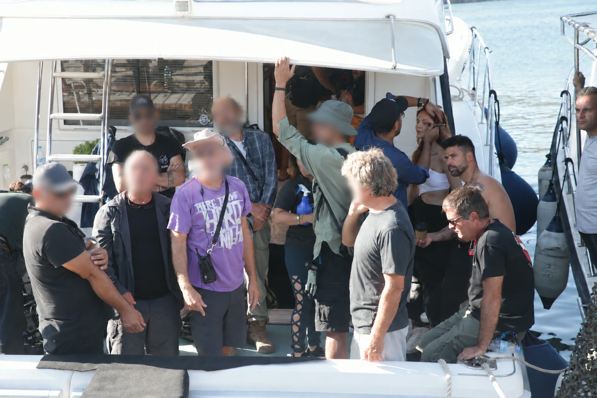 El Señor 7 cast and production crew gathered beside the location boat