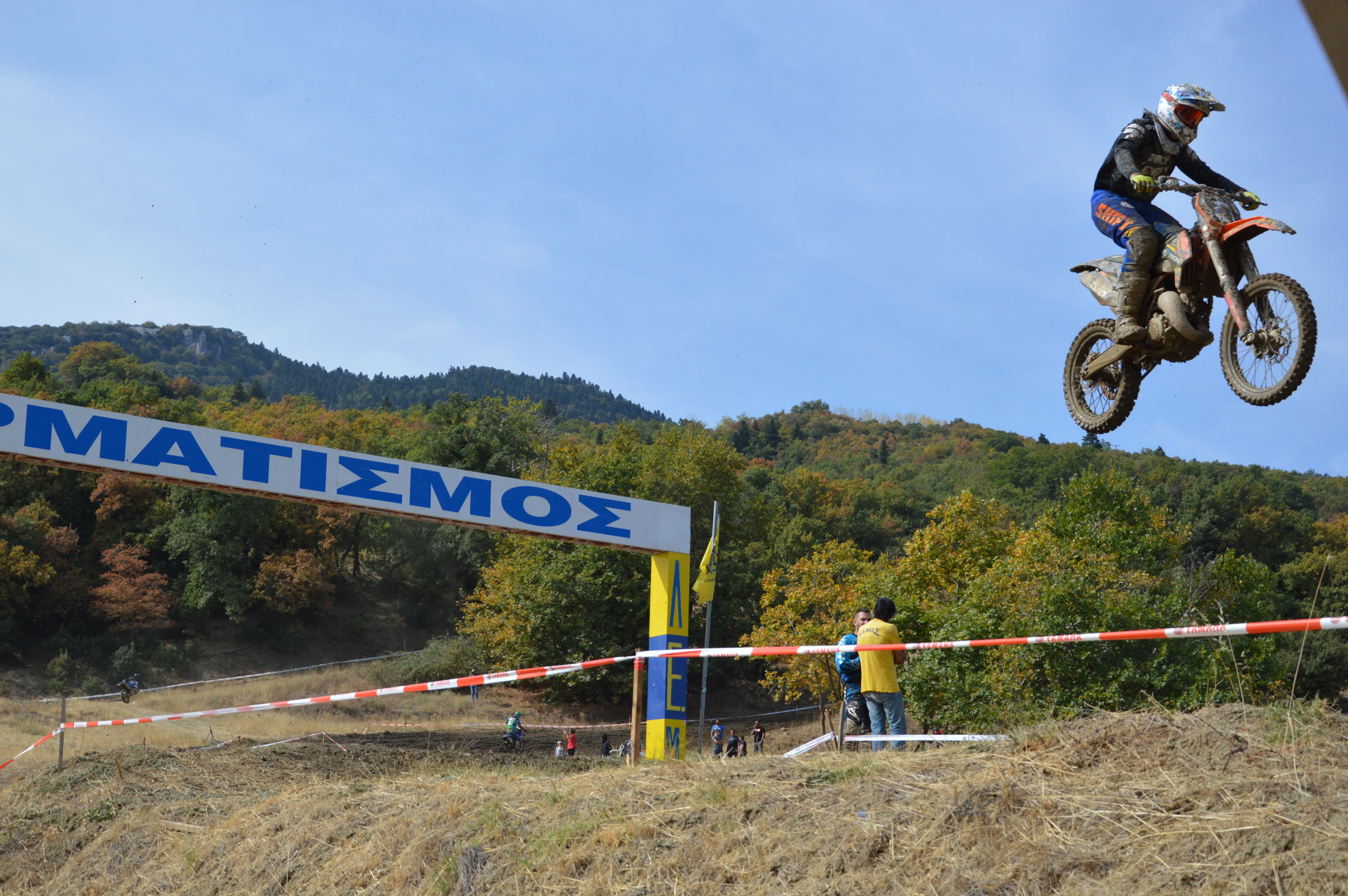 Motorcycle rider airborne during a mountain race